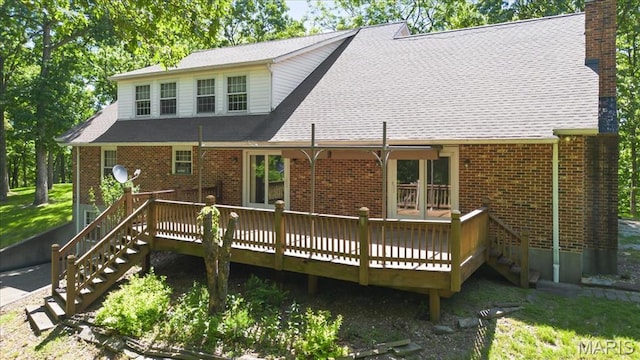 3743 Rock Creek Valley Rd, High Ridge, MO 63049 - rear view of property featuring stairway, a chimney, a deck, and brick siding