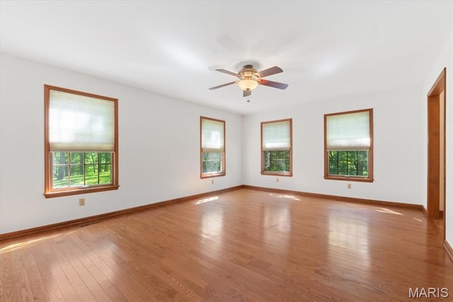 3743 Rock Creek Valley Rd, High Ridge, MO 63049 - empty room featuring baseboards, wood finished floors, and ceiling fan