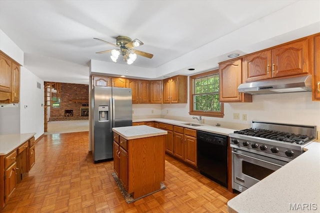 3743 Rock Creek Valley Rd, High Ridge, MO 63049 - kitchen featuring under cabinet range hood, stainless steel appliances, ceiling fan, a center island, and light countertops