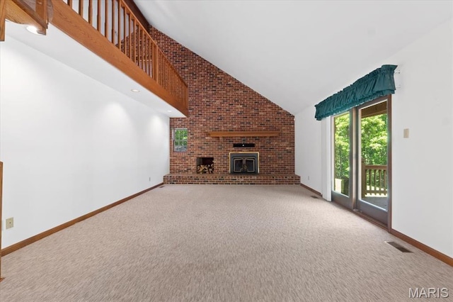 3743 Rock Creek Valley Rd, High Ridge, MO 63049 - unfurnished living room featuring high vaulted ceiling, carpet, brick wall, baseboards, and a brick fireplace
