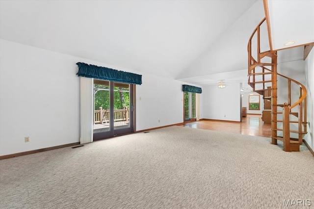 3743 Rock Creek Valley Rd, High Ridge, MO 63049 - unfurnished living room with carpet flooring, stairs, high vaulted ceiling, and baseboards