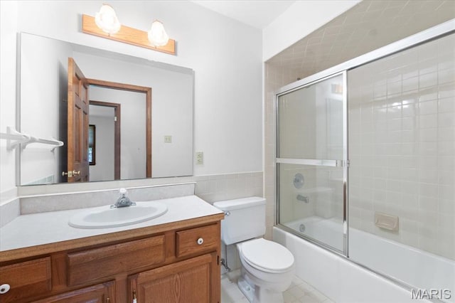 3743 Rock Creek Valley Rd, High Ridge, MO 63049 - bathroom with vanity, toilet, bath / shower combo with glass door, tile walls, and tile patterned floors