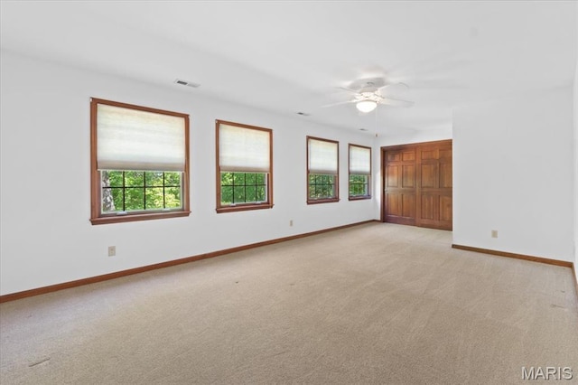 3743 Rock Creek Valley Rd, High Ridge, MO 63049 - empty room featuring light carpet, baseboards, and ceiling fan