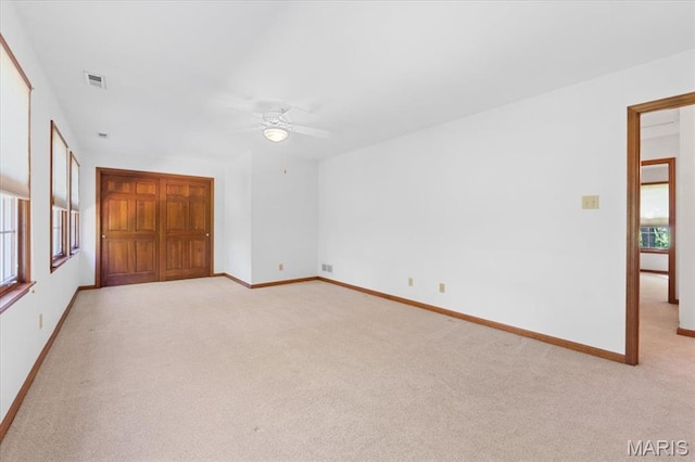 3743 Rock Creek Valley Rd, High Ridge, MO 63049 - spare room featuring light carpet, ceiling fan, and baseboards
