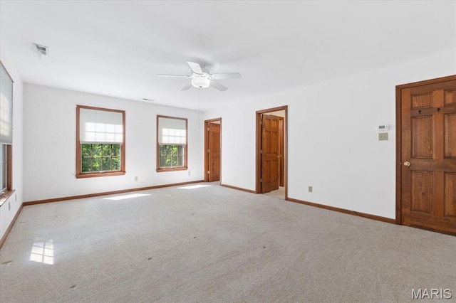 3743 Rock Creek Valley Rd, High Ridge, MO 63049 - spare room featuring ceiling fan, light colored carpet, and baseboards