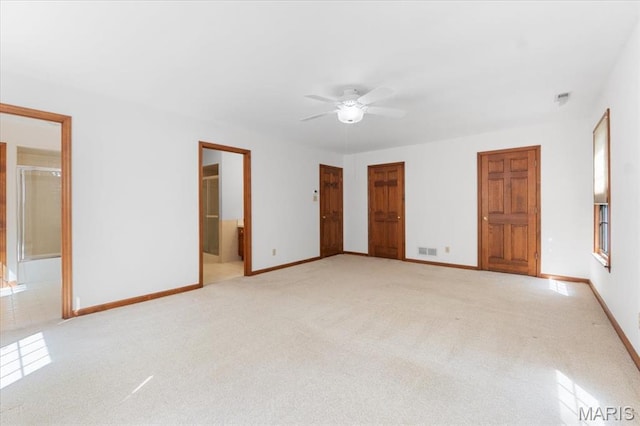 3743 Rock Creek Valley Rd, High Ridge, MO 63049 - unfurnished bedroom featuring light colored carpet, baseboards, ensuite bathroom, and ceiling fan