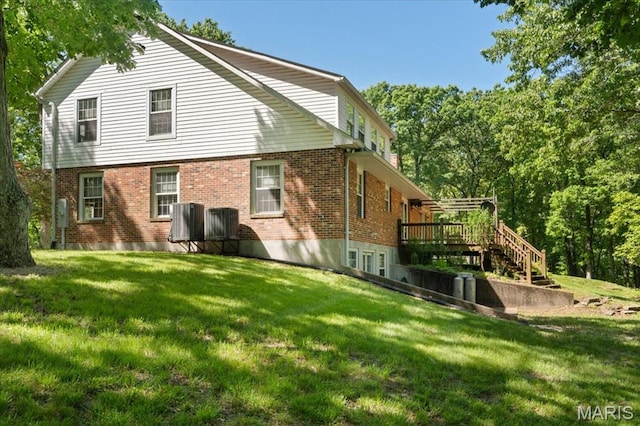 3743 Rock Creek Valley Rd, High Ridge, MO 63049 - rear view of property with brick siding, a deck, and a lawn