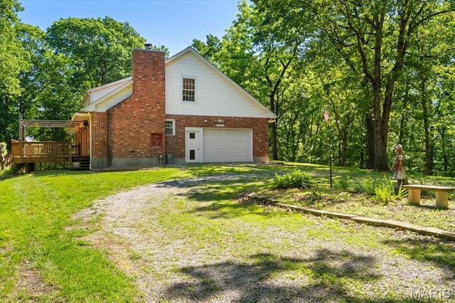 3743 Rock Creek Valley Rd, High Ridge, MO 63049 - view of side of home featuring driveway, a chimney, a deck, a lawn, and brick siding