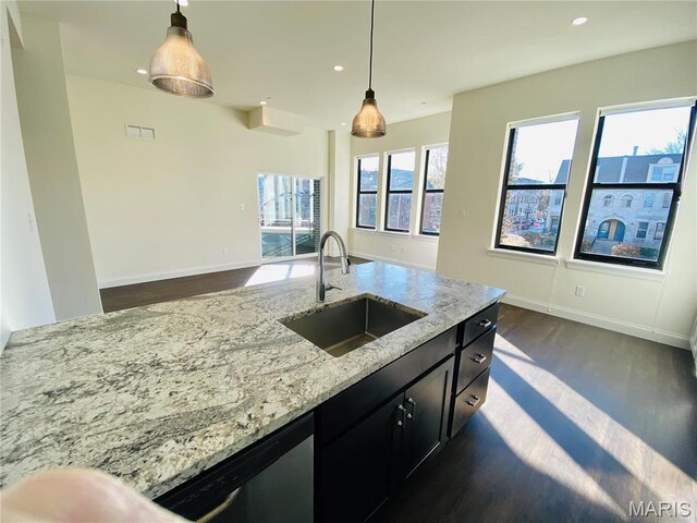 4301 Maryland Ave Unit 2, Saint Louis, MO 63108 - kitchen with a sink, dark cabinetry, dark wood finished floors, pendant lighting, and recessed lighting
