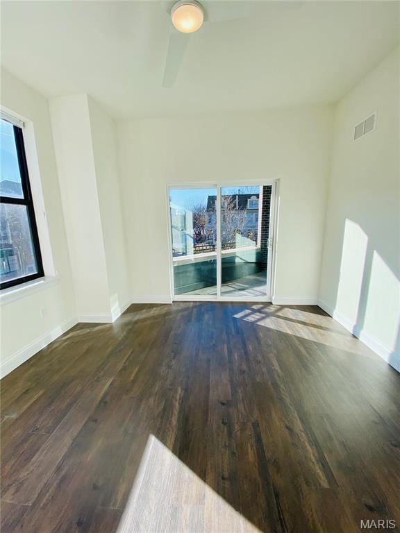 4301 Maryland Ave Unit 2, Saint Louis, MO 63108 - empty room with wood finished floors, a ceiling fan, and baseboards
