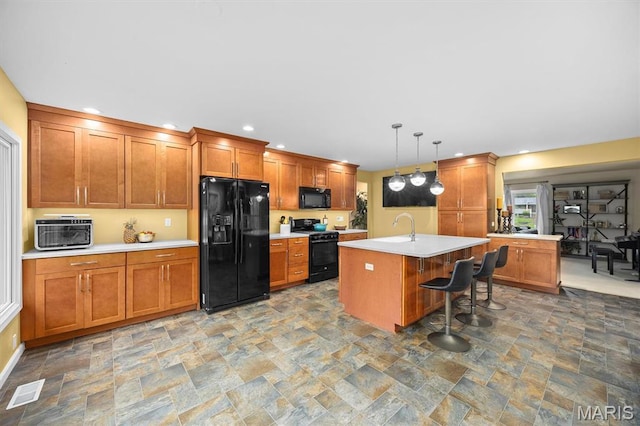 350 Barnett Dr, Edwardsville, IL 62025 - kitchen featuring black appliances, stone finish flooring, a sink, and recessed lighting