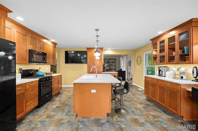 350 Barnett Dr, Edwardsville, IL 62025 - kitchen featuring black appliances, stone finish flooring, a sink, baseboards, and recessed lighting