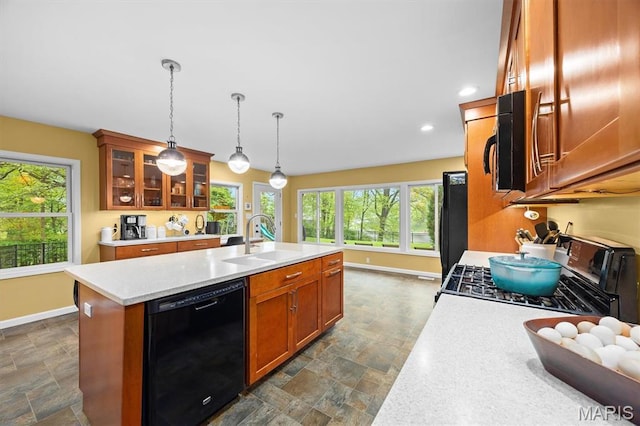 350 Barnett Dr, Edwardsville, IL 62025 - kitchen with black appliances, a sink, stone finish flooring, baseboards, and recessed lighting