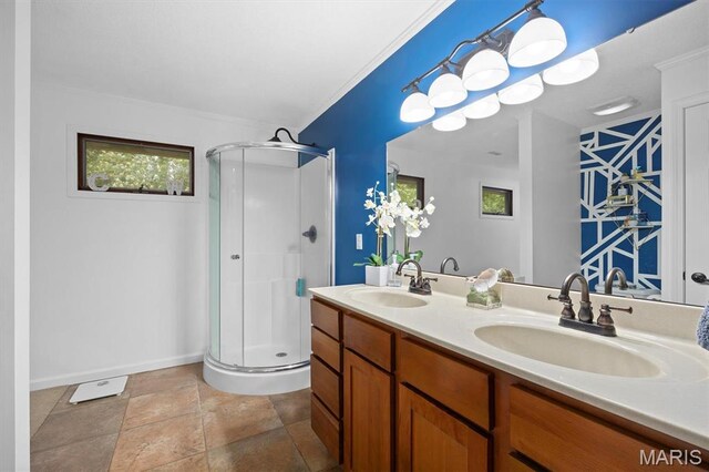350 Barnett Dr, Edwardsville, IL 62025 - bathroom with a stall shower, baseboards, double vanity, and ornamental molding