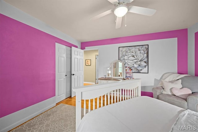 350 Barnett Dr, Edwardsville, IL 62025 - bedroom with light wood finished floors, baseboards, a ceiling fan, and a closet