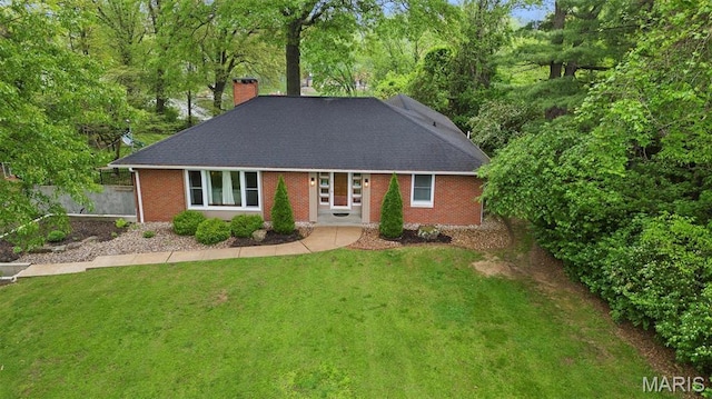350 Barnett Dr, Edwardsville, IL 62025 - view of front facade with a chimney, brick siding, and a shingled roof