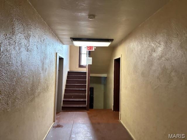 3936 Cook Ave, Saint Louis, MO 63113 - corridor featuring stairs, concrete floors, and a textured wall