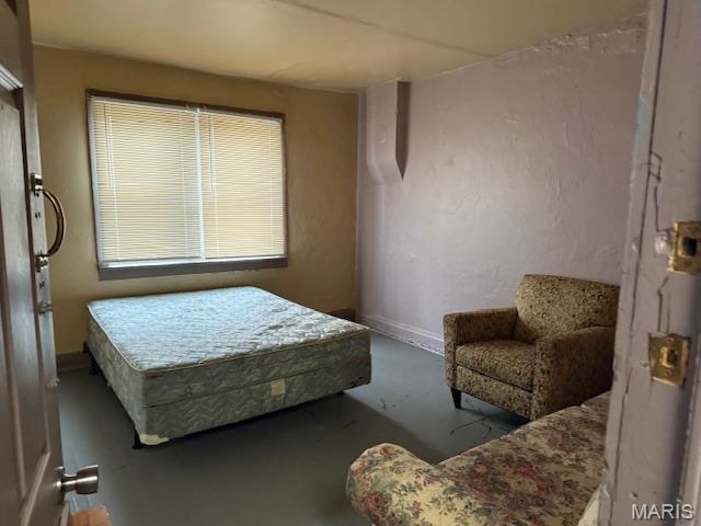 3936 Cook Ave, Saint Louis, MO 63113 - bedroom with concrete floors