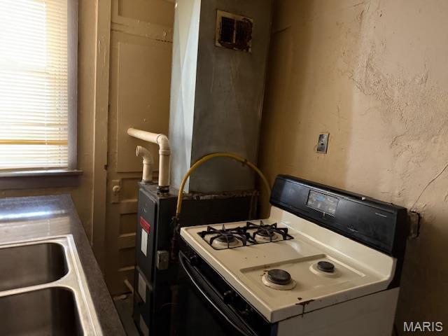 3936 Cook Ave, Saint Louis, MO 63113 - kitchen featuring white range with gas cooktop and a sink
