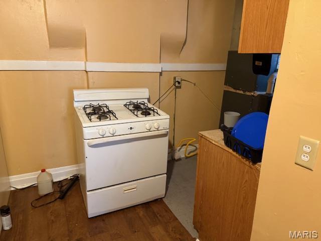 3936 Cook Ave, Saint Louis, MO 63113 - kitchen featuring white range with gas stovetop and dark wood finished floors