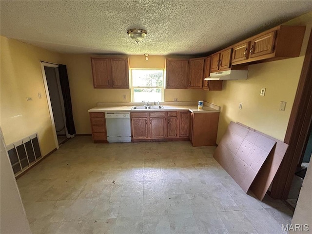 1923 Ridgeway Dr, Arnold, MO 63010 - kitchen featuring white dishwasher, brown cabinets, a textured ceiling, under cabinet range hood, and light countertops