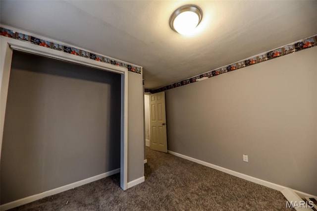226 N 8th St, Belleville, IL 62220 - unfurnished bedroom with dark colored carpet and baseboards