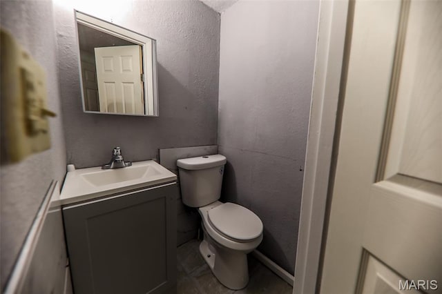226 N 8th St, Belleville, IL 62220 - half bath featuring vanity, toilet, and tile patterned floors