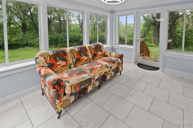 sunroom / solarium with tile patterned flooring