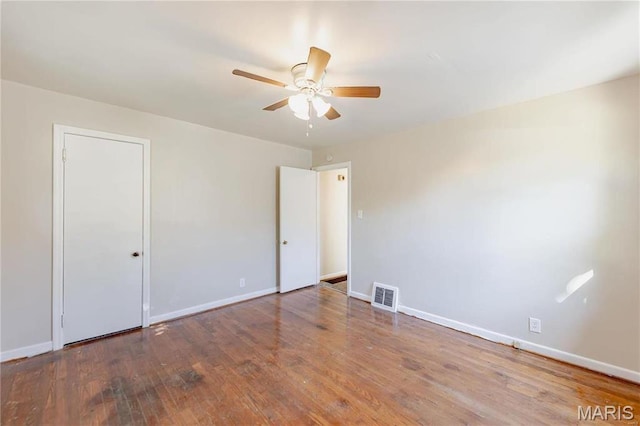 7150 Beulah Ave, Saint Louis, MO 63136 - unfurnished bedroom with baseboards, wood finished floors, and ceiling fan