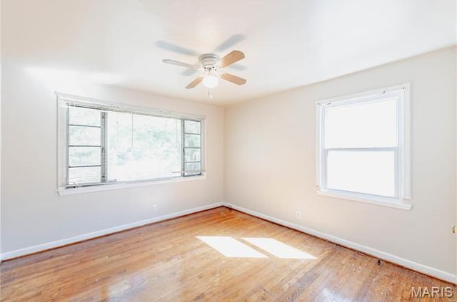 7150 Beulah Ave, Saint Louis, MO 63136 - unfurnished room with baseboards, wood finished floors, and a ceiling fan