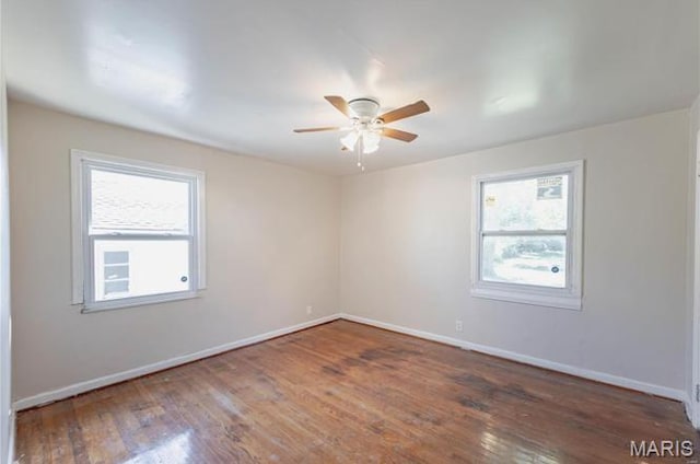 7150 Beulah Ave, Saint Louis, MO 63136 - spare room with plenty of natural light, ceiling fan, wood finished floors, and baseboards