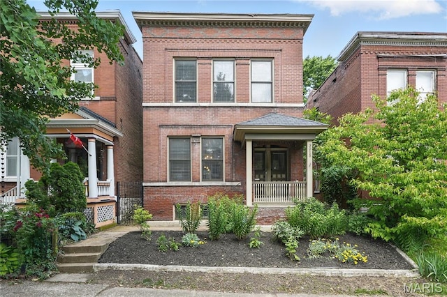 3015 Indiana Ave, Saint Louis, MO 63118 - view of front of house with a porch and brick siding