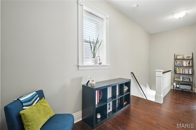3015 Indiana Ave, Saint Louis, MO 63118 - sitting room with an upstairs landing, wood finished floors, and baseboards