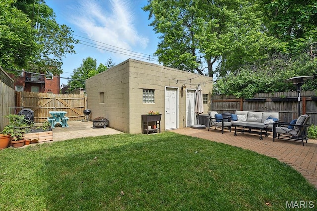 3015 Indiana Ave, Saint Louis, MO 63118 - view of outbuilding with an outdoor living space with a fire pit