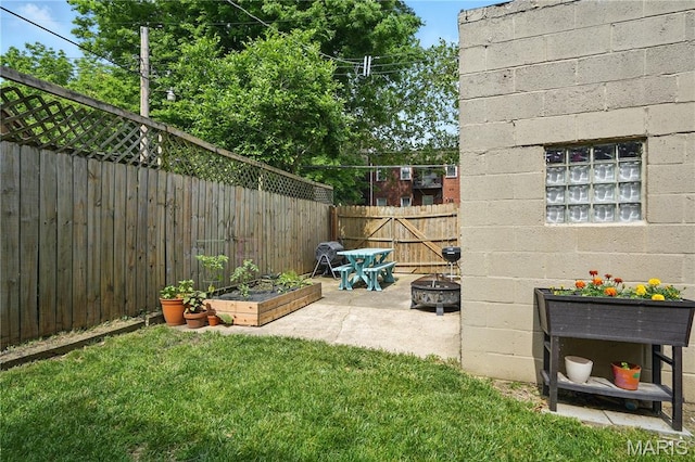 3015 Indiana Ave, Saint Louis, MO 63118 - view of yard with a fire pit, a patio, and a garden