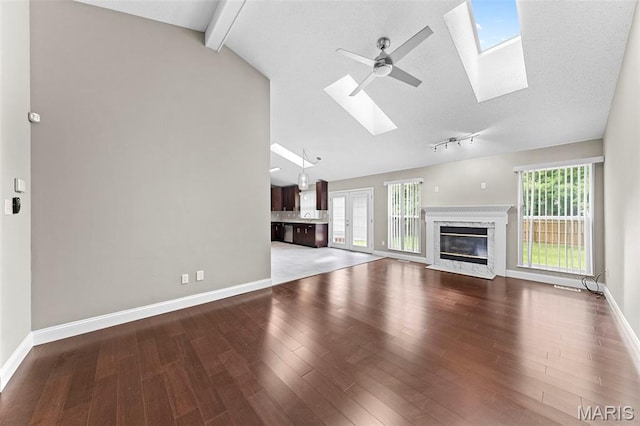 2713 Chapel View Dr, Florissant, MO 63031 - unfurnished living room with a skylight, baseboards, and ceiling fan