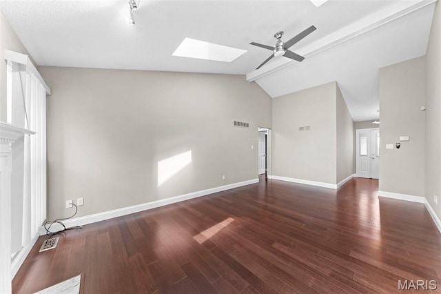 2713 Chapel View Dr, Florissant, MO 63031 - unfurnished living room with a skylight, ceiling fan, vaulted ceiling, wood finished floors, and baseboards