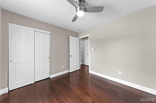 2713 Chapel View Dr, Florissant, MO 63031 - unfurnished bedroom featuring baseboards, a closet, wood finished floors, a textured ceiling, and ceiling fan
