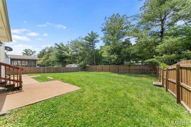 2713 Chapel View Dr, Florissant, MO 63031 - view of yard featuring a patio and a sunroom