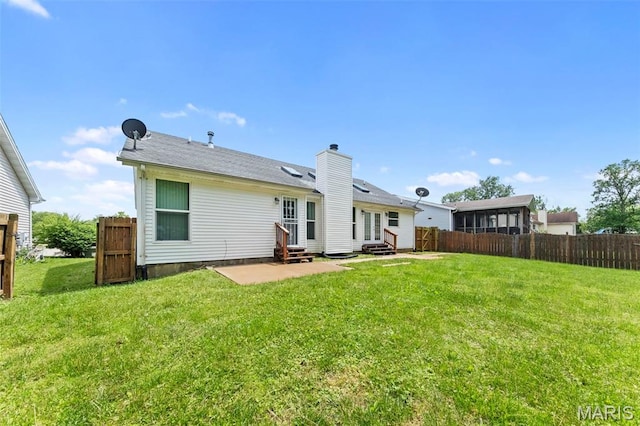 2713 Chapel View Dr, Florissant, MO 63031 - rear view of property with entry steps, a patio, and a chimney