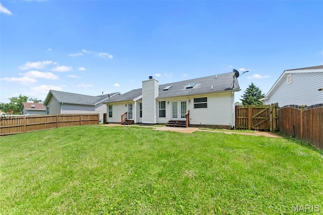 2713 Chapel View Dr, Florissant, MO 63031 - rear view of property with entry steps, french doors, a chimney, a gate, and a patio