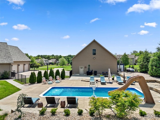 111 Foristell Ridge Ct, Foristell, MO 63348 - view of swimming pool featuring a patio area, a water slide, and fence