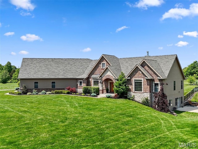 111 Foristell Ridge Ct, Foristell, MO 63348 - view of front of home featuring a front yard, brick siding, and stone siding