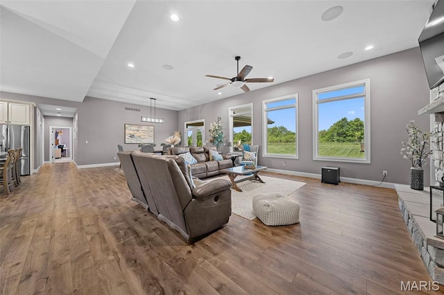 111 Foristell Ridge Ct, Foristell, MO 63348 - living room with ceiling fan, wood finished floors, baseboards, recessed lighting, and a fireplace