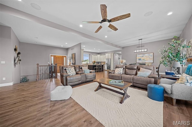 111 Foristell Ridge Ct, Foristell, MO 63348 - living room with light wood-style flooring, a ceiling fan, recessed lighting, and baseboards