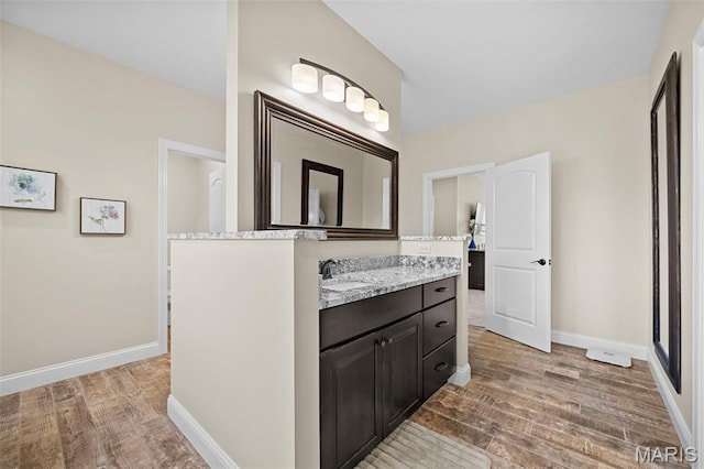 111 Foristell Ridge Ct, Foristell, MO 63348 - bathroom with wood finished floors, vanity, and baseboards