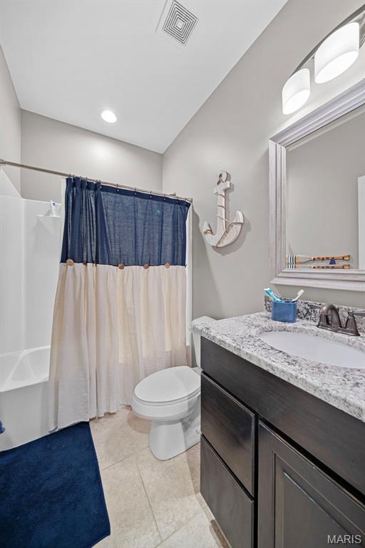 111 Foristell Ridge Ct, Foristell, MO 63348 - bathroom featuring toilet, vanity, and tile patterned flooring