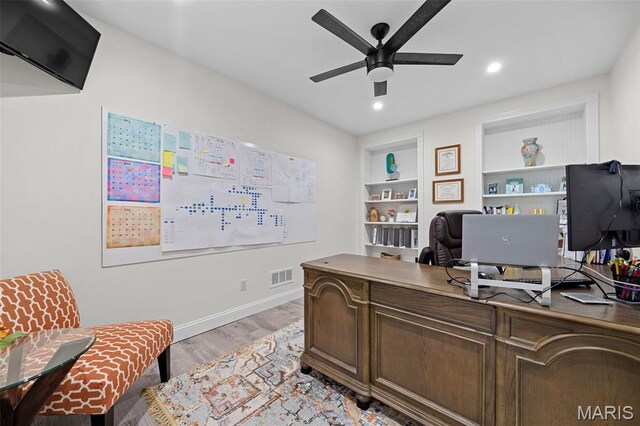 111 Foristell Ridge Ct, Foristell, MO 63348 - office space with ceiling fan, light wood-style flooring, recessed lighting, built in shelves, and baseboards
