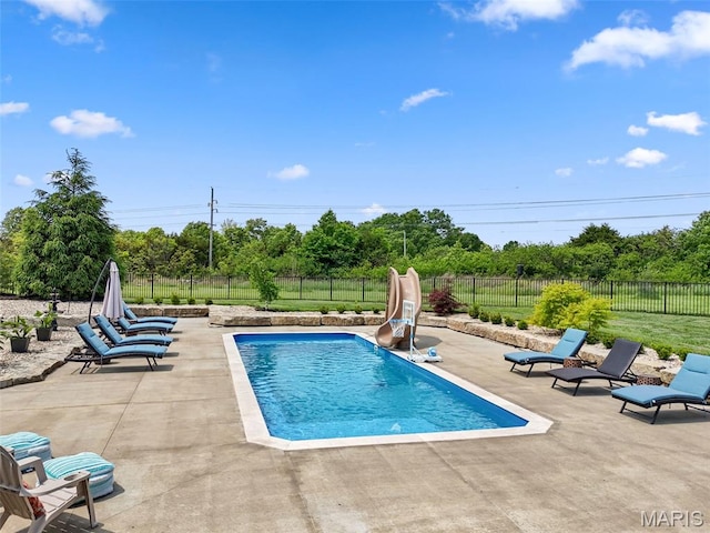 111 Foristell Ridge Ct, Foristell, MO 63348 - view of pool with a water slide, a patio area, a fenced backyard, and view of wooded area