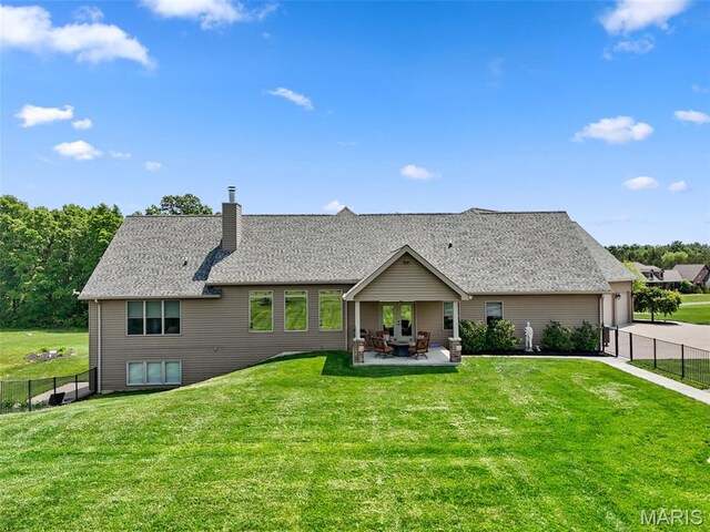 111 Foristell Ridge Ct, Foristell, MO 63348 - back of property featuring a chimney and a patio area